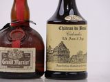 two bottles of liquor sitting next to each other on a table