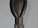 a close up of a metal hook on a wall