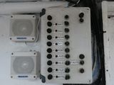 a bunch of electrical equipment on the side of a boat