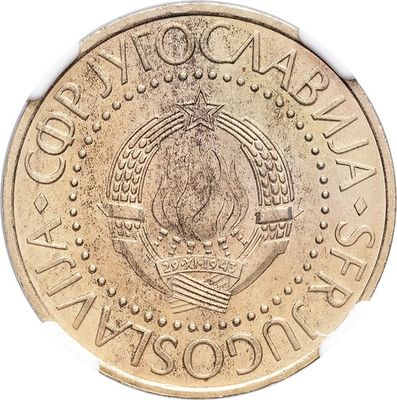 a close up of a coin on a white surface with a white background