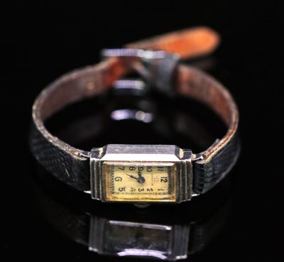 an image of a watch on a black surface