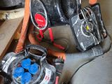 a blower and a hose on the floor in a room