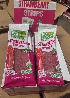two bags of strawberries in a box on the table