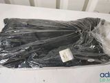 a bag of black plastic material on a white table