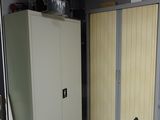 a tall cabinet in the corner of the room