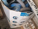 a box full of hoses and other tools sitting on the floor