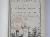 an old book with a stamp on it sitting on a table