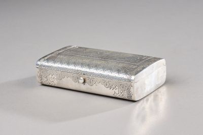 a silver box sitting on a table with a white background
