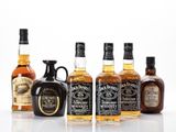 a group of bottles of whiskey sitting next to each other