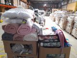 a cart full of towels and other items in a warehouse