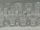 a lot of glasses that are sitting on a table