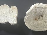 two pieces of rock on the table next to each other