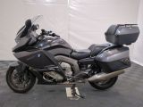 a picture of a motorcycle parked on a checkered floor