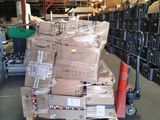 a large pile of boxes sitting on a pallet in a warehouse