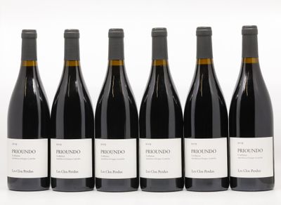 six bottles of red wine are lined up in a row