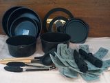 a lot of pots and pans that are on a table