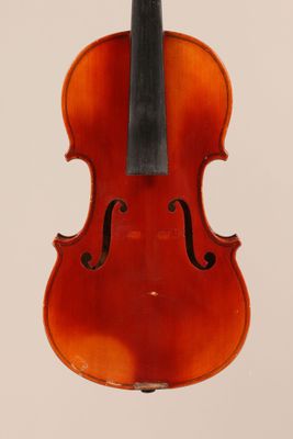 an old violin with a bow hanging from it ' s back