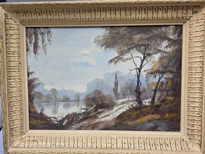 une photo d'un tableau représentant un paysage, dans un cadre