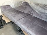 a couch that is being wrapped up in a room
