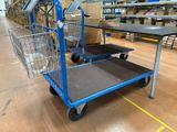 a shopping cart that is sitting on the floor in a warehouse
