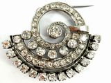 a picture of a brooch with a lot of diamonds on it