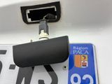a close up of a license plate with a camera attached to it