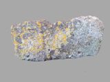 a large rock with yellow lichens on it