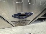 a stainless steel oven with a digital display on the side