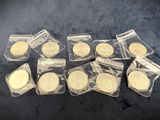 a bunch of gold coins sitting on top of a table