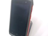 a cell phone that is sitting on top of a stand