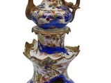 an image of a blue and white vase with a bird on it