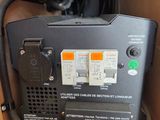 a box with a radio and a fan inside of it