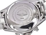 the watch is silver and has a white dial