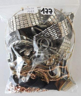 a bag of assorted metal items on a table