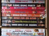 many dvds stacked on top of each other in a box