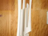 a white sculpture on a wooden table in a room