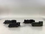 three toy trains that are sitting on a table