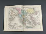 an open book with a map of north america on it