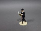 a figurine of a man reading a book