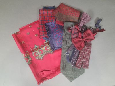 many different types of ties laid out on a table