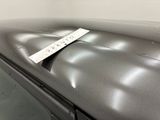 a sticker on the hood of a car with a name tag