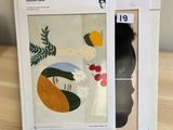an image of a box with a picture of a woman and a bird on it