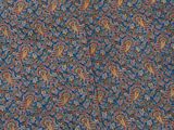 a close up of a blue and red paisley print fabric