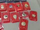 a lot of red trays with medals on them