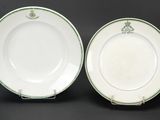 a pair of green and white plates sitting on top of each other