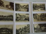 an open book with pictures of old buildings and people on the pages