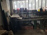 a picture of a workbench in a building with a lot of tools on it