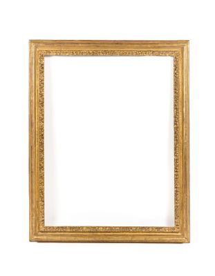 a gold frame on a white wall with a white background