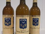 three bottles of wine sitting on top of a table next to each other