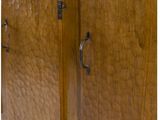 an image of a wooden cabinet with metal handles